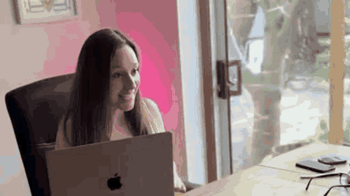 Cordelia working at her laptop