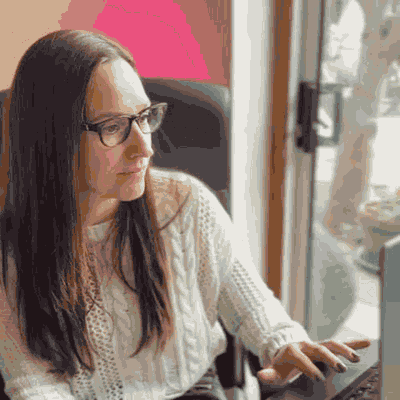 Cordelia at her laptop, typing
